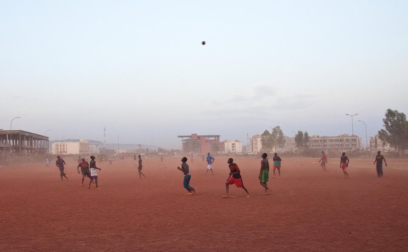 Young men playing football in Bamako, Mali